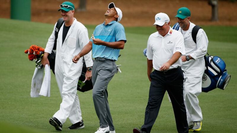 Tiger Woods  laughs with Mark O’Meara  during a practice round  at Augusta National Golf Club. Photograph: Ezra Shaw/Getty Images