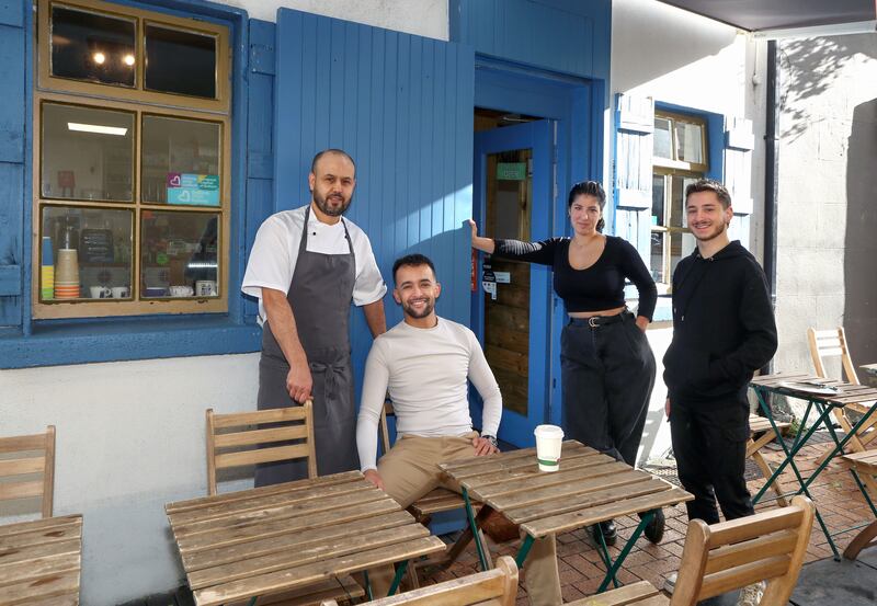 Mohamed Farouq, far left, outside Lane Cafe, at Druid Lane, Galway, with, from left, Hicham Altit, manager, and baristas Ines Tebbani and Luca Parente Photograph: Joe O’Shaughnessy
