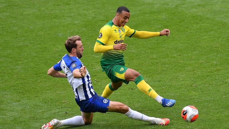 Irish striker Adam Idah is tackled by Brighton’s Dale Stephens during Norwich’s 1-0 defeat. Photograph: Justin Setterfield/Getty