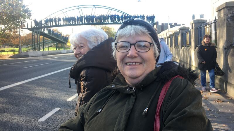 Pic of Siobhán Kennedy (56) at Fairview footbridge to watch Gay Byrne funeral cortège. Photograph: Jack Power