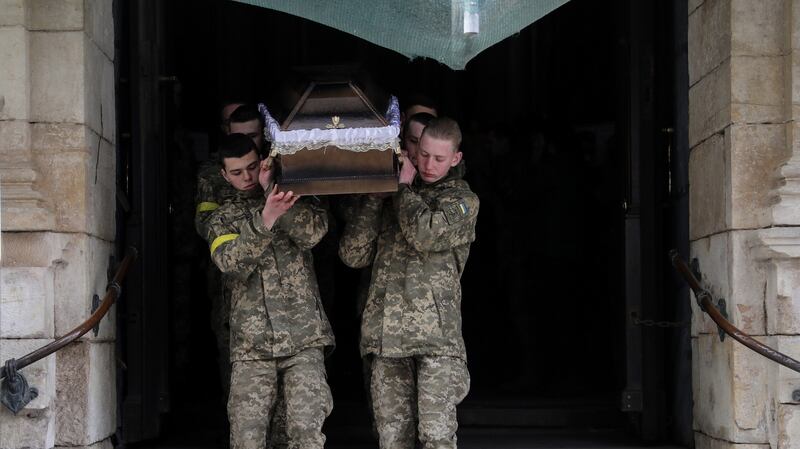 Ukrainian service men carry the coffins of fallen comrades in Lviv, Ukraine. File photograph: EPA