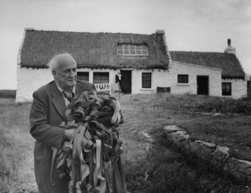 September 1949. Film director Robert J Flaherty during a visit to the Aran Islands, Co Galway, 14 years after making the film, Man of Aran. He is holding a bundle of film from the original shoot, which was left in a cottage on the island. Photo by Haywood Magee/Picture Post/Hulton Archive/Getty Images