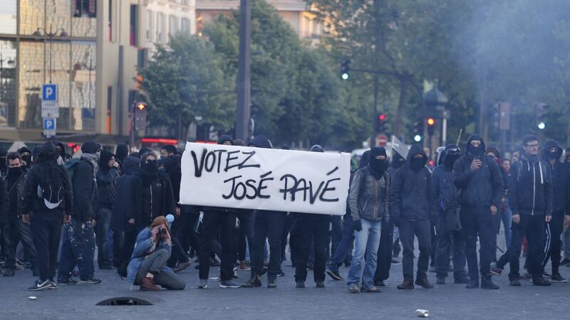 Anti-fascists stand behind a banner reading “Vote José Pavé (cobblestone)” as they demonstrate in Paris on April 23rd, 2017 following the announcement of the results of the first round of the presidential election. Centrist Emmanuel Macron finished ahead of far-right leader Marine Le Pen. Photograph: Benjamin Cremel/AFP/Getty Images