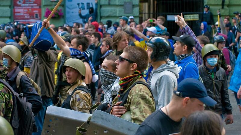 Single Ukraine supporters gear up before clashing with  pro-Russian protesters in downtown Odessa, Ukraine, today. At least one person was shot dead and more than 10 people were injured in the clashes. Photograph: Sergey Gumenyuk/EPA
