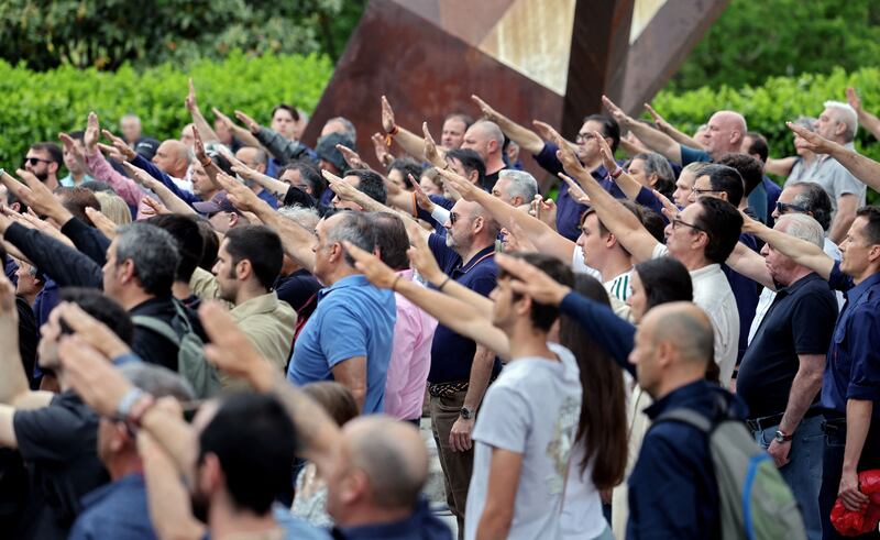 Far-right supporters perform the fascist salute after paying tribute to the founder of Falange, Jose Antonio Primo de Rivera, outside the San Isidro cemetery in Madrid on April 29th, 2023. Photograph: Thomas Coex/AFP/Getty