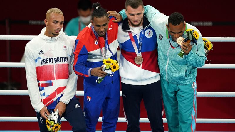 Whittaker didn’t wear his medal for podium photos. Photo: Mike Egerton/PA Wire