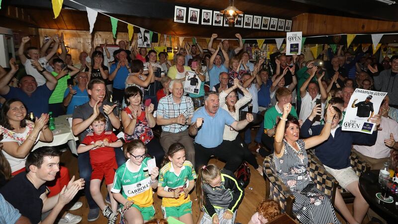 Supporters at Shane Lowry’s home golf club, Esker Hills Golf Club, Tullamore, Co Offaly, celebrate his victory. Photograph: Lorraine O’Sullivan/PA