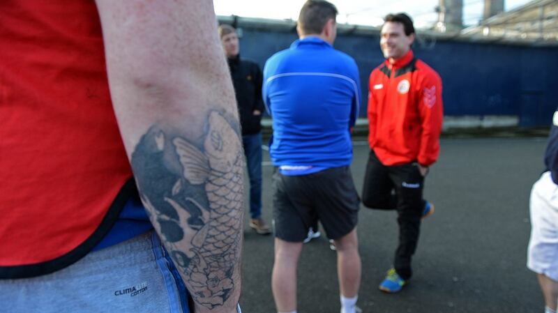 Bohemians coach Jeff Conway talks to players at the outdoor pitch at Mountjoy. Photograph: Eric Luke