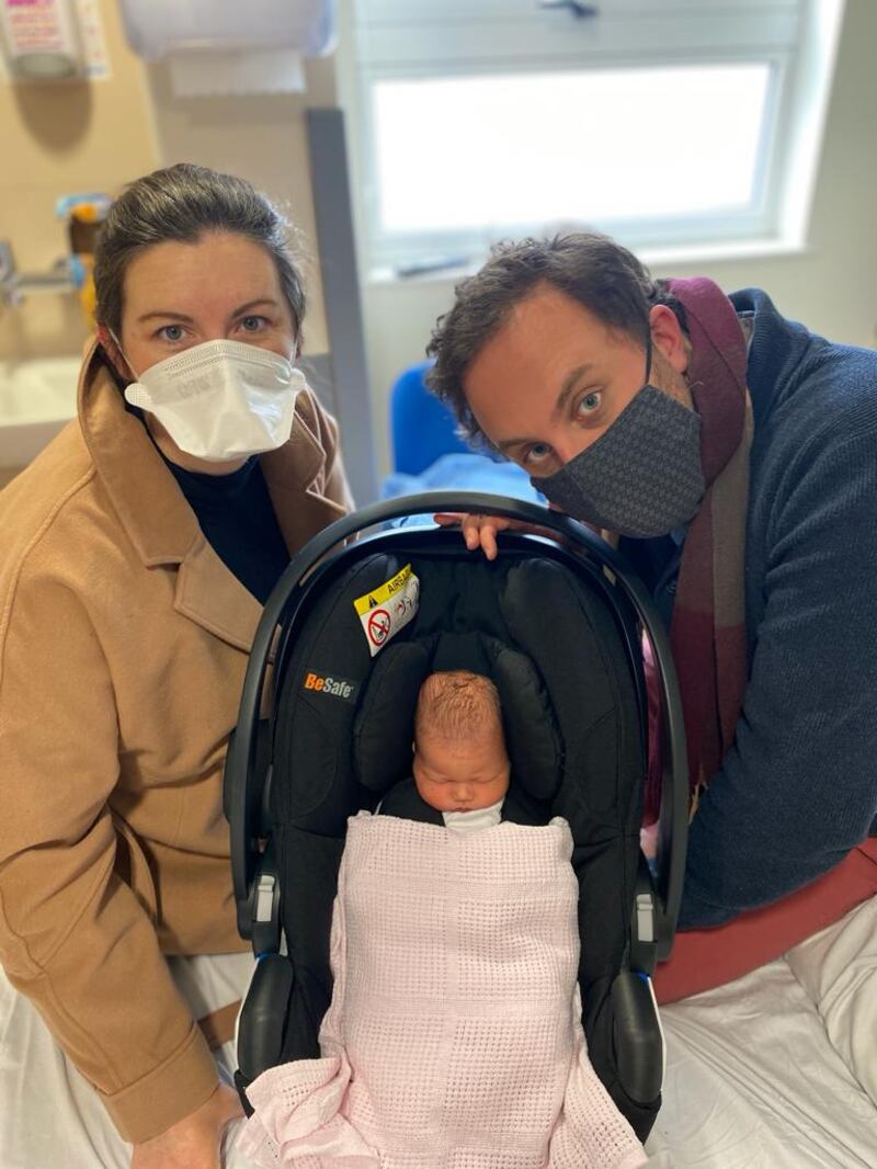 Aisling Marron and husband David Jones leaving hospital with their newborn daughter.