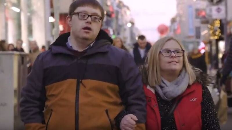 The video for Christmas in Cork shows David Horgan (29) and Megan O’Halloran (28), who have Down syndrome, wandering through Cork city at Christmas, enjoying the festive delights. Screengrab: Russian Roulette/Down Syndrome Cork/Youtube
