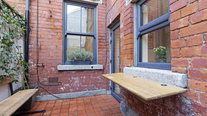 The rear courtyard area at 46 East Wall Road