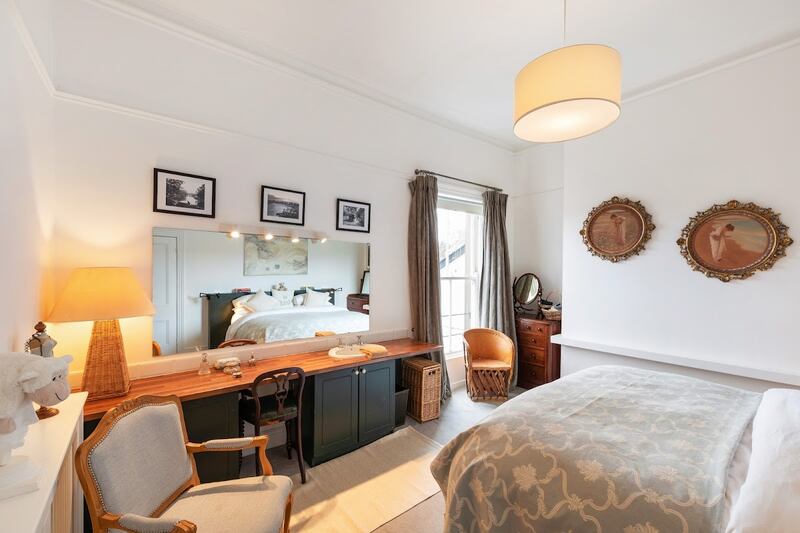 Principal Bedroom with fitted units and sink