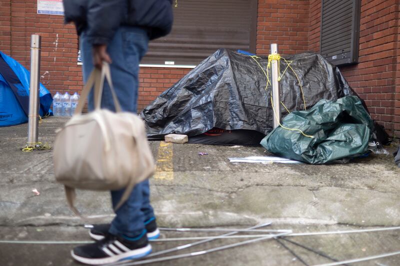 More than a dozen homeless male asylum seekers have returned to the makeshift camp in Dublin city centre on Mount Street, after being brought to an alternate site 20km away in Crooksling. Photograph: Chris Maddaloni/The Irish Times


