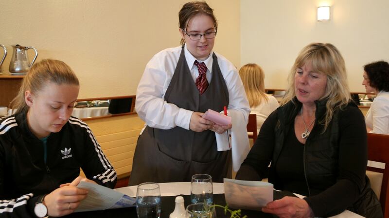 Springboard culinary arts students Jennie Vahlstrom and Kate Watson give   Melissa Allen their order at GMIT’s Galway campus. Photograph: Joe O’Shaughnessy