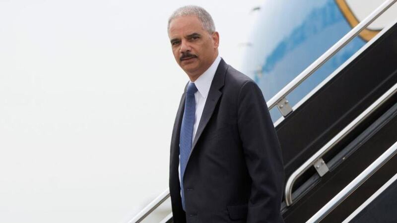 US attorney general Eric Holder arrives at Lambert-St. Louis airport yesterday. Photograph: Reuters/Pablo Martinez Monsivais