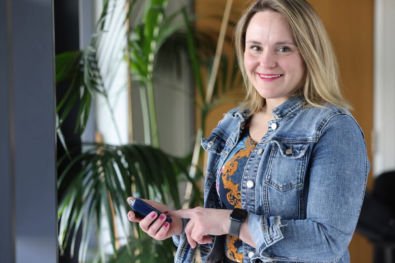 Dr Kate Gajewska, clinical manager for advocacy and research at Diabetes Ireland, with a wearable system that incorporates a continuous glucose monitor with an automated insulin pump. Photograph: Dara Mac Dónaill