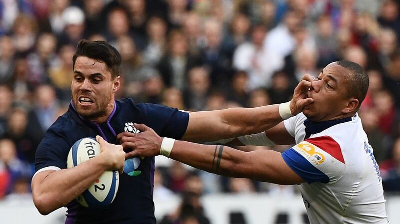 Scotland’s winger Sean Maitland fends off France’s centre Gael Fickou. Photograph: Anne-Christine Poujoulat/Getty Images