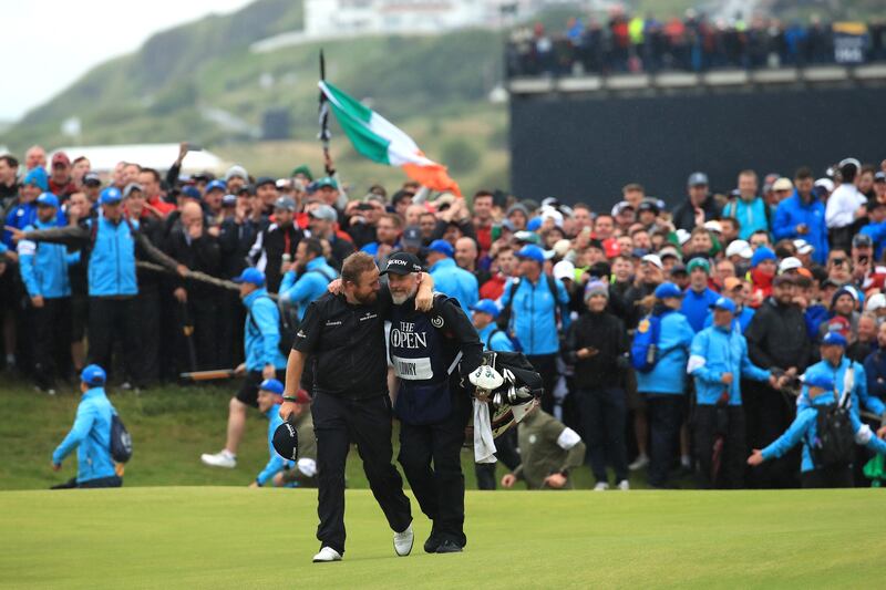 Shane Lowry celebrates with caddie Bo Martin on the 18th hole during the final round of the 148th Open Championship on the Dunluce Links at Royal Portrush Golf Club, July 2019. Photograph: Andrew Redington/Getty Images