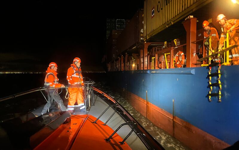 Marine operative Sean Flanagan with Captain Colm Newport on board a pilot vessel in Dublin Bay before Newport boards the ship and then pilots it into Dublin Port. Photograph: Bryan O'Brien