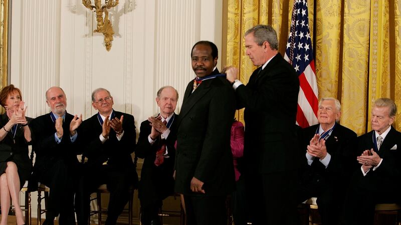 Paul Rusesabagina  recieves the US Presidential Medal of Freedom from  George W Bush  at the White House on November 9th, 2005. Photograph: Mark Wilson/Getty Images
