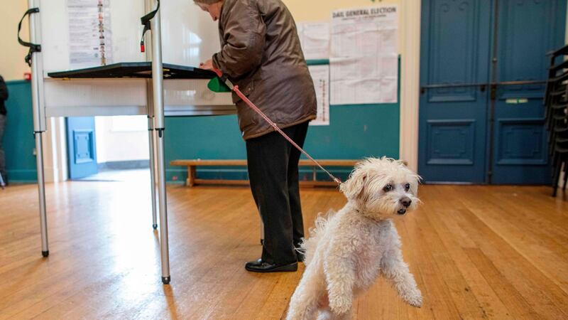 A woman fills out her ballot paper in  Bunscoil Chriost Rí school in Cork. Photograph: Paul Faith/AFP/Getty