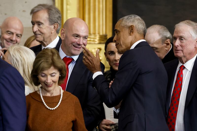 Former US president Barack Obama speaks with UFC CEO Dana White, with former US first lady Laura Bush also pictured, after the inauguration of President Donald Trump. Photograph: Shawn Thew/Getty Images