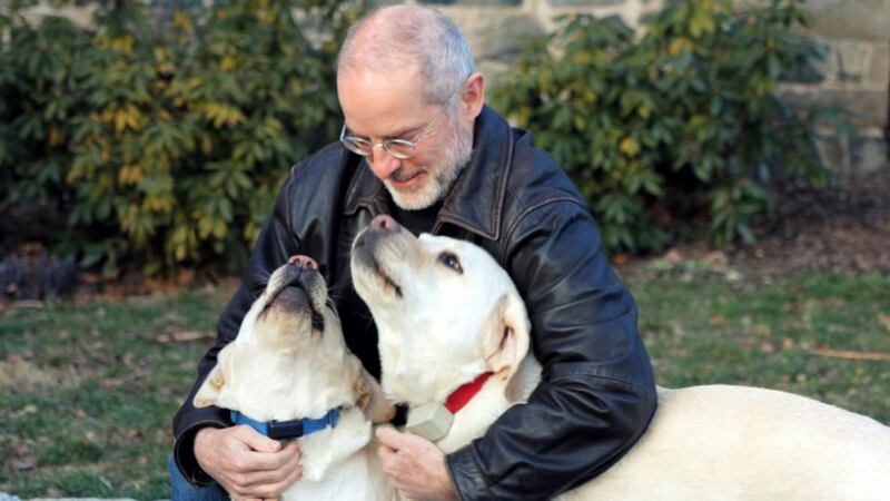 John Grogan, author of ‘Marley and Me’, with two of his dogs