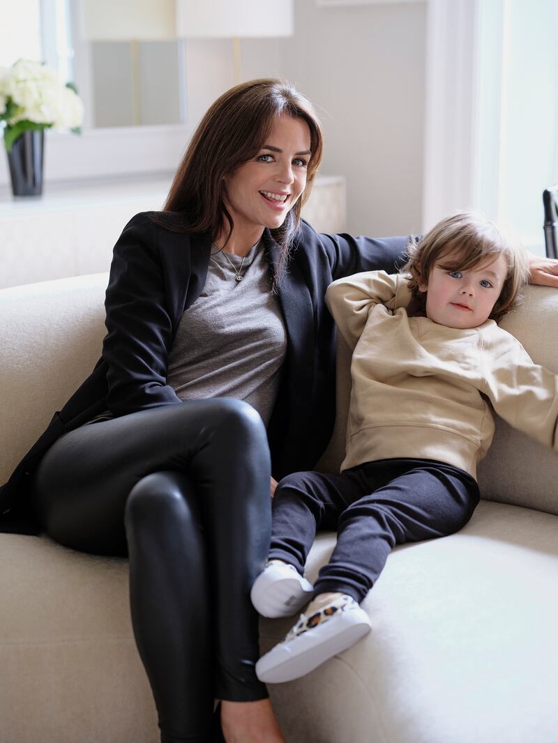 Maoliosa Murray with her son Max in her showroom apartment: ‘I wanted to have my baby here and educate him here.’ Photograph: Simon Watson