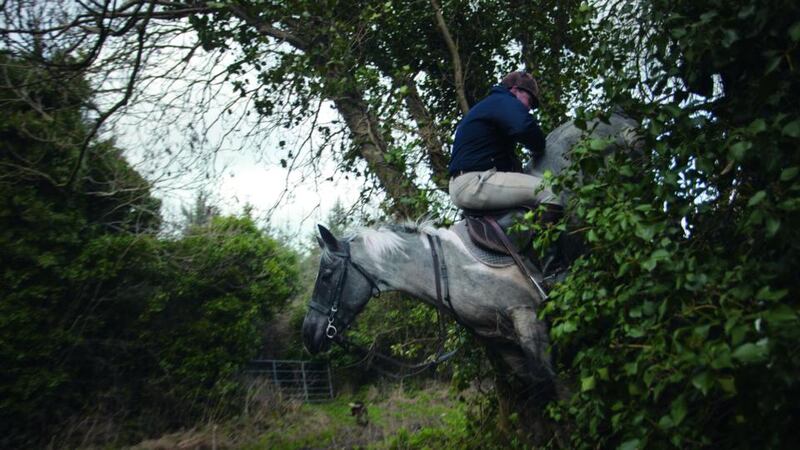 Through a hedge backwards: “There was a particularly tricky hedge in Co Wexford that a jockey I met made a song and dance about getting over,” says Seamus Murphy. “This other guy claimed he could do it backwards. I bet him 50 quid he couldn’t do it, and he did, and I got this picture. It was the starting point for the book”