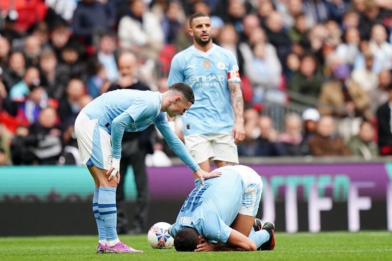 Manchester City's Rodri goes down injured during the Emirates FA Cup semi-final match at Wembley Stadium. City's marathon campaign could cost Spain dearly at the Euros in Germany this summer as Rodri has become their most important player. Photograph: Zac Goodwin/PA