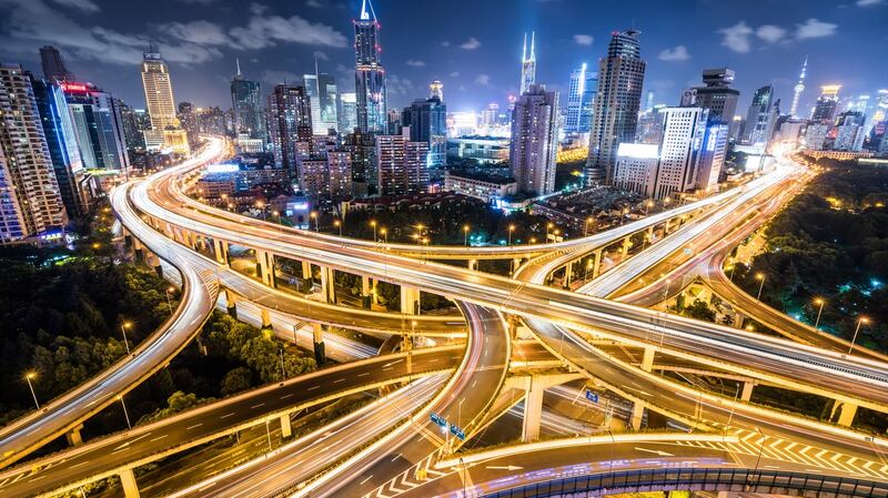 Cars passing a road intersection in downtown Shanghai. Photograph: iStock