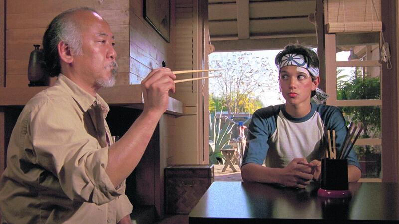 Man who catch fly with chopstick: Pat Morita and Ralph Macchio in The Karate Kid