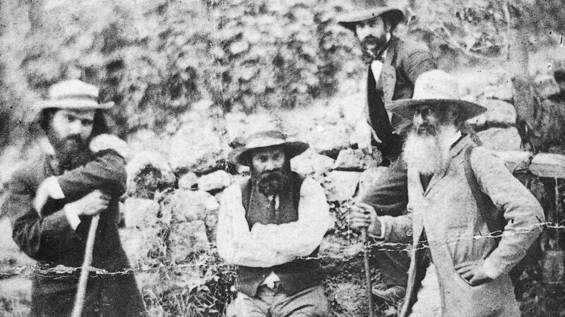 Cézanne (centre) and Camille Pissarro (far right)