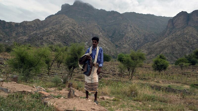 Ali al-Hajaji at the grave of his four-year-old son, Shaadi, in Juberia, Yemen. Photograph: Tyler Hicks/The New York Times
