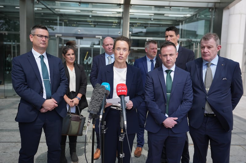 Superintendent Ann Marie Twomey (centre) reads a statement to the media outside the Criminal Courts of Justice in Dublin, after the sentencing of Richard Satchwell who was found guilty of the murder of his wife, Tina Satchwell, whose remains were found under the stairs of their home in Youghal, Co Cork Photograph: Niall Carson/PA Wire