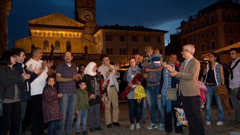 Syrian refugees are welcomed as they arrive at the St. Egidio Community in Rome on Saturday. Photograph: Alessandra Tarantino/AP