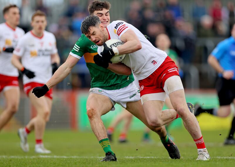 Kerry’s Séan O'Shea and Mattie Donnelly of Tyrone struggle for possession. File photograph: James Crombie/Inpho