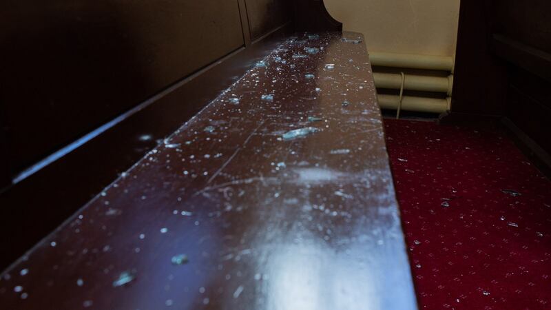 Broken glass on  pews in Saint Catherine’s Church, Tullamore, Co Offaly. Photograph: Ger Rogers Photography