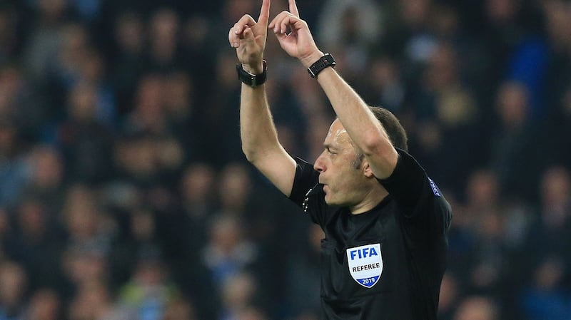 Turkish referee Cüneyt Çakir calls for a VAR after Raheem Sterling’s stoppage-time strike for Manchester City against Tottenham Hotspur. Photograph: Lindsey Parnaby/AFP/Getty Images