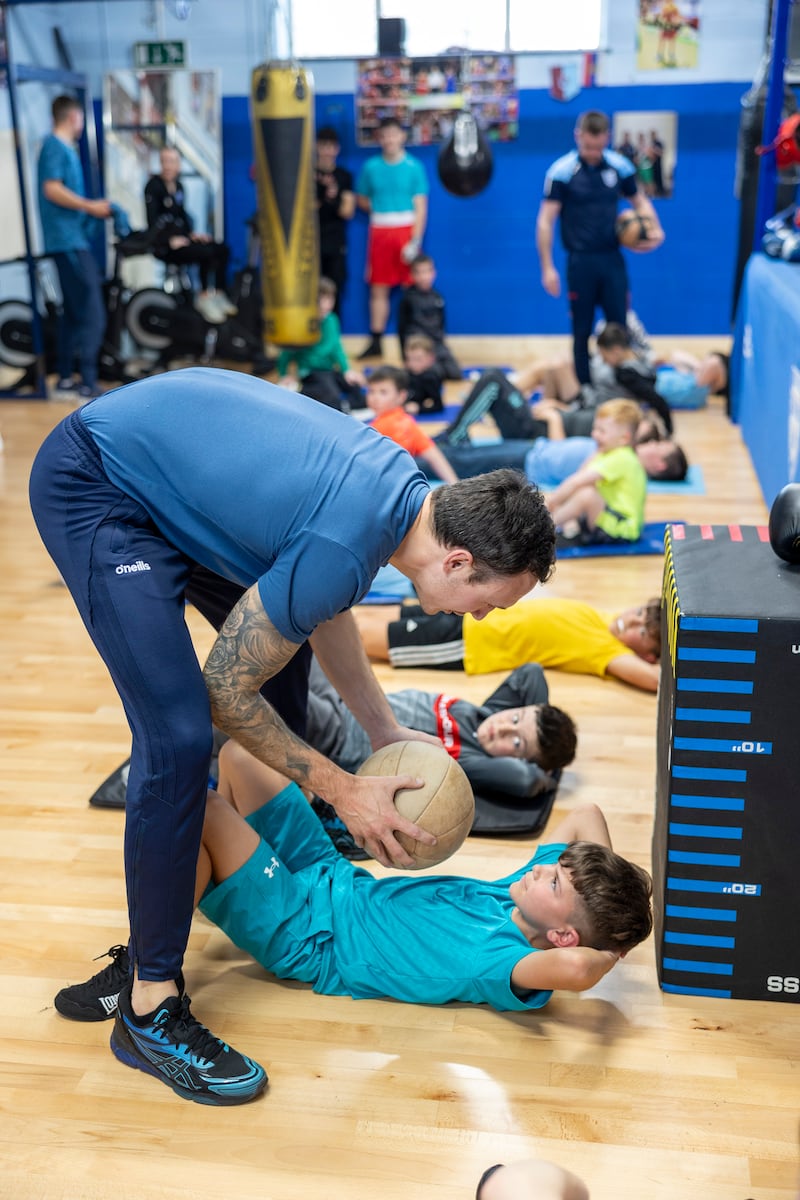 Coach Mick McDonald and Lewis Byrne, aged 9. Photograph: Tom Honan
