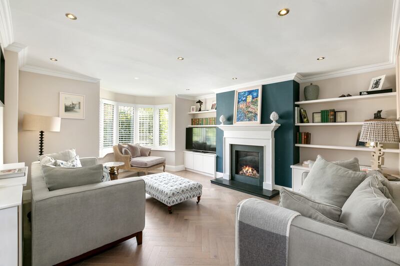 A formal living room lies to the front of the property