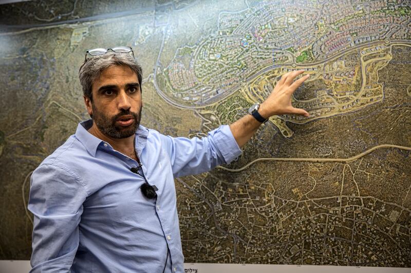 Yair Chetboun, mayor of West Bank Israeli settlement city Ariel, points to a map showing while saying he wants to quadruple the amount of Jewish Israelis living there. Photograph: Sally Hayden
