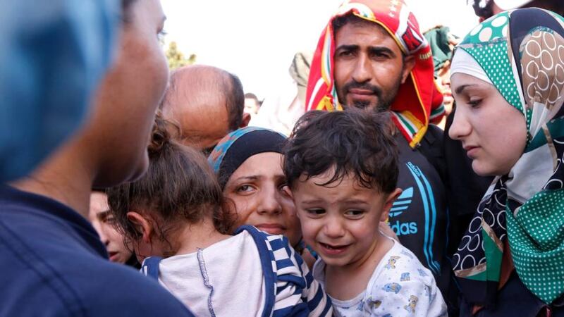 Police in Hungary transfer migrants into buses at the Croatian border near Beremend, Hungary,  September 18th, 2015. Photograph: Antonio Bat/EPA