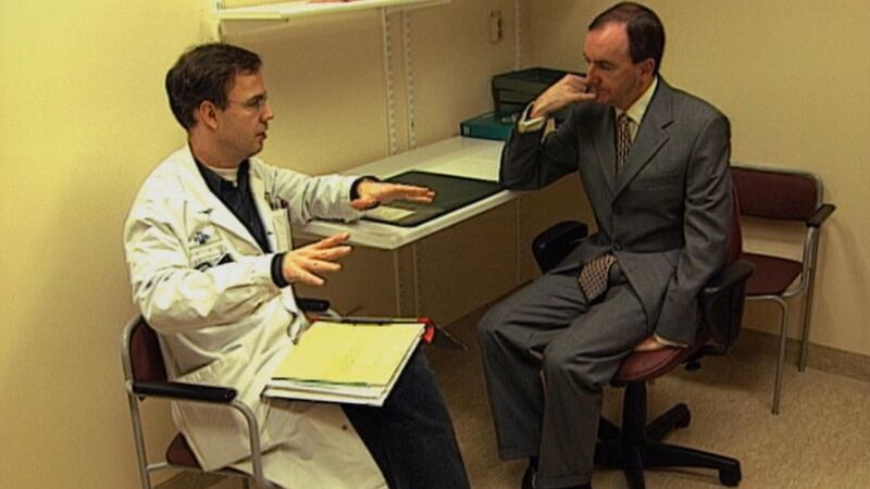Tommie Gorman receives a doctor’s consultation in 1994, in a clip from Ireland, Cancer and Me