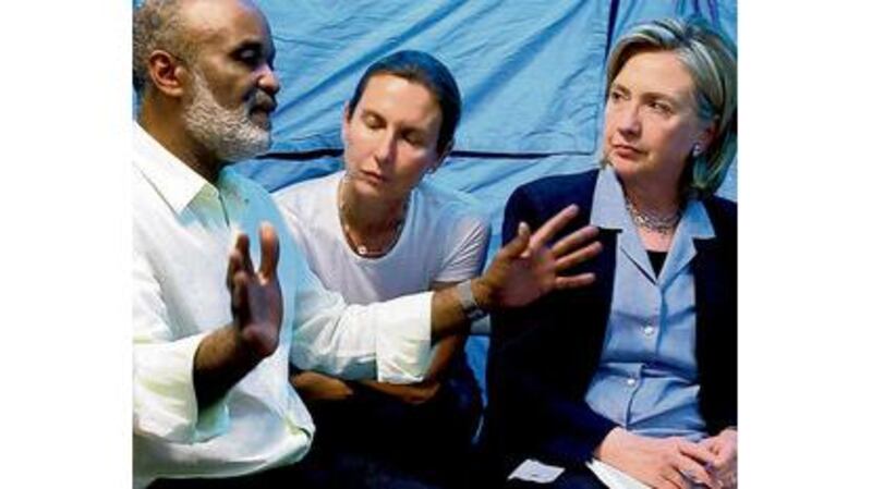 US secretary of state Hillary Clinton with Haitis president Rene Preval (left) during talks in Port-au-Prince on the crisis. Photographs: Julie Jacobson, Gerald Herbert/AP Photo, Getty Images