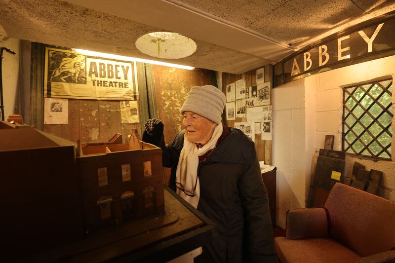 Joan Hanly at her home in Killiney with the original bill boards and signage from the Abbey Theatre and also a scale model of the theatre. Photograph: Alan Betson
