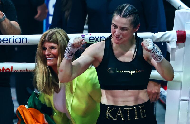 Katie Taylor celebrates winning alongside her mother, Bridget. Photograph: Gary Carr/Inpho