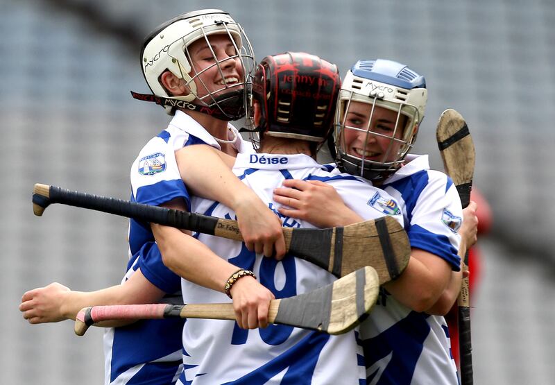 Niamh Rockett, Jenny McCarthy and Deirdre Fahey celebrate at the final whistle in the All-Ireland Junior Camogie Championship final in 2011. Photograph: Ryan Byrne/Inpho