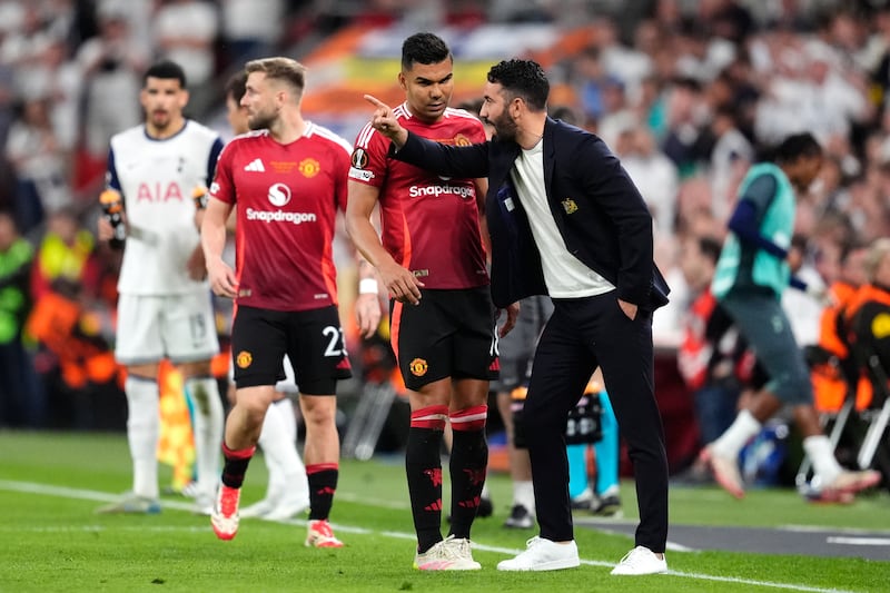 Manchester United manager Ruben Amorim (right) speaks to Casemiro during the Europa League final. Photograph: Nick Potts/PA