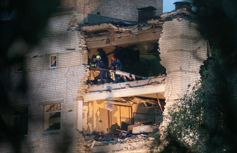 Rescue workers clear debris from a destroyed floor of a military academy struck by Russian missiles in Poltava, Ukraine. Photograph: David Guttenfelder/The New York Times            